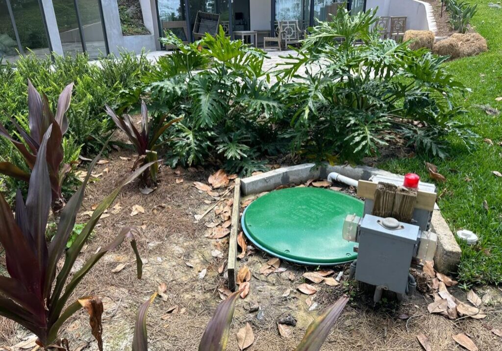 homeowner photo of a brenlin seal-r septic cover in the backyard